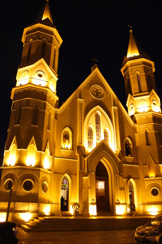 A church lit up at night. 